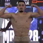 AnEsonGib flexing muscles at weigh in in Qatar