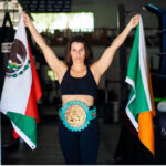 Female boxer Maureen Shea holds Mexican and Irish flags