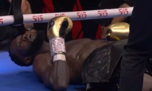 Deontay Wilder lying down on the canvas after KO by Zhilei Zhang