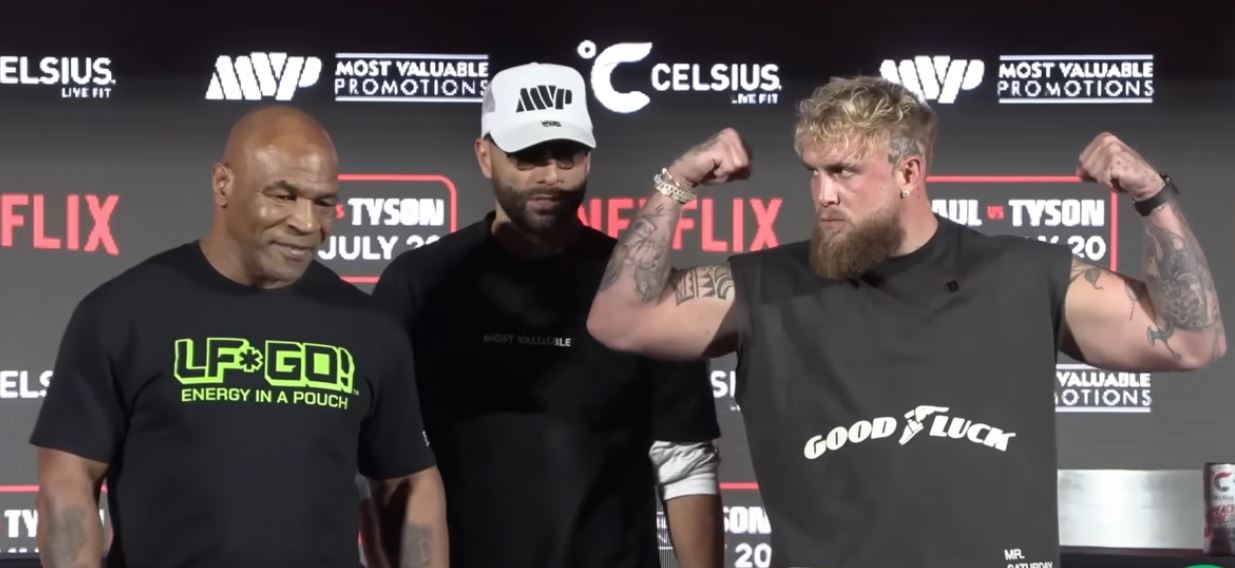 Boxing legend Mike Tyson and Jake Paul pose for photos at presser