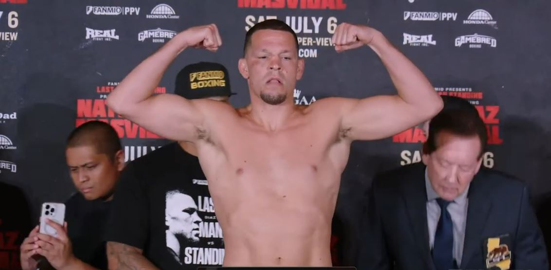 Nate Diaz flexing muscles after weigh in for his boxing match with Jorge Masvidal